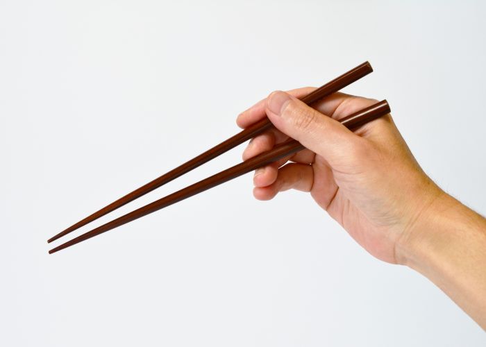 chopsticks held in a hand